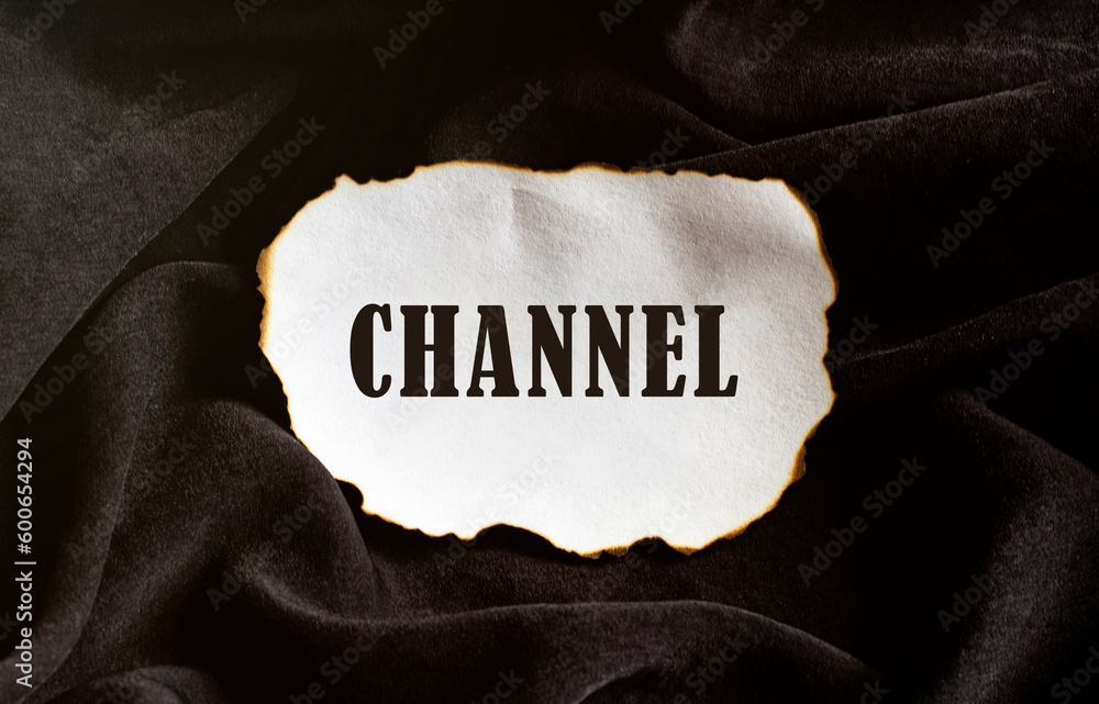 Poster burned paper on a black background with text channel