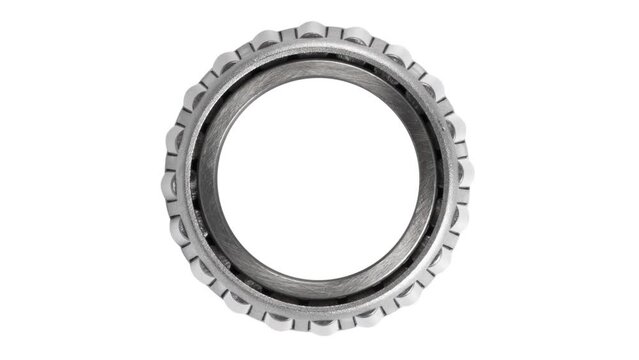 Wheel hub. Metal silver ball bearing with balls on white isolated background. Industrial bearing rotates. Stainless metal roller. Spare parts with wheel hub