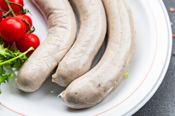 Raw white sausage weisswurst veal, pork, lard, spices natural meal food snack on the table copy space food background rustic top view