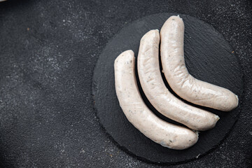 Raw white sausage weisswurst veal, pork, lard, spices natural meal food snack on the table copy...