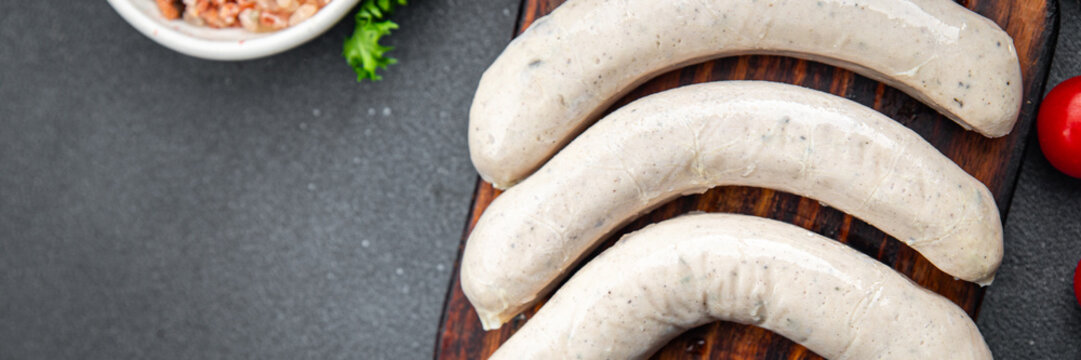 Raw white sausage weisswurst veal, pork, lard, spices natural meal food snack on the table copy space food background rustic top view