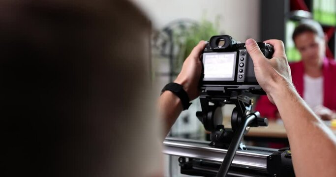 Business woman corporate business interview in office. Videographer shoots a business blog for aonline TV channel