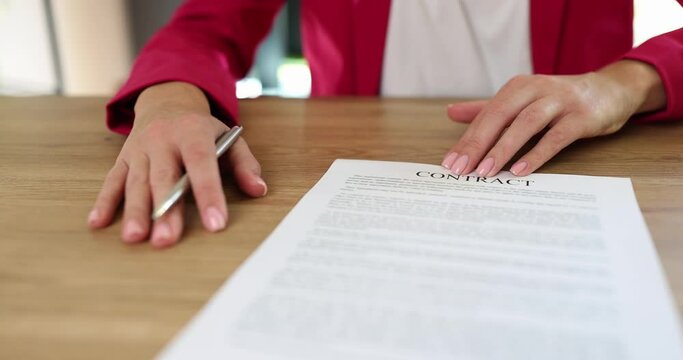 Seo or insurance agent offers pen to sign new employment contract and insurance. Partner promises a good deal