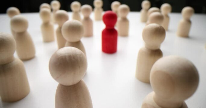 Conceptual image of person standing out from crowd as leader. Inspirational teacher or politician diplomat among people