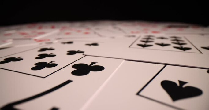 Lots of playing cards on black background. Poker game and illegal casino