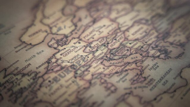 Germany and European countries on a vintage political world map. Slow motion, tracking arc shot. 