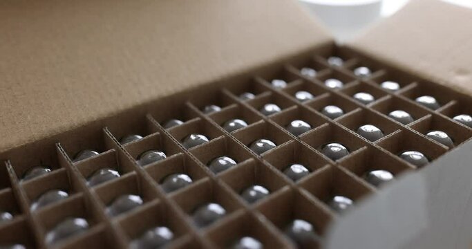 Paper box with glass bottles of wine or glass jars. Transportation and packaging of fragile products