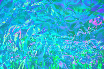 Fototapeta na wymiar Abstract holographic background in 80s, 90s style. Modern pastel green, blue, mint, turquoise crumpled metallic psychedelic holographic foil texture. Vaporwave, psychedelic retro futurism, syberpunk