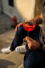 Drinking Campari Spritz in Venice Italy during Golden Hour