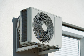 air conditioner outdoor unit on a black background
