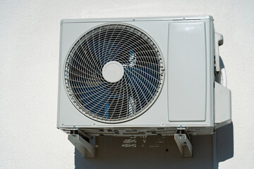 air conditioner outdoor unit on a black background