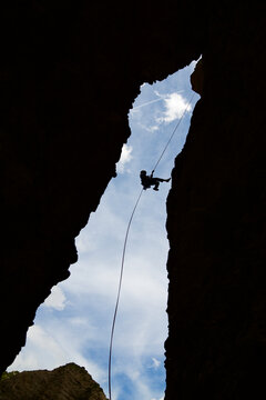 Rappel in the Mallos de Riglos, the peak known as Aguja Roja.