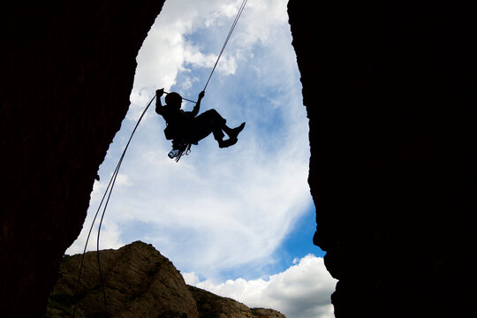 Rappel in the Mallos de Riglos, the peak known as Aguja Roja.