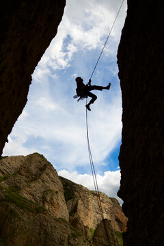 Rappel in the Mallos de Riglos, the peak known as Aguja Roja.