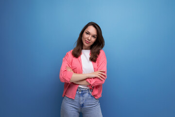 long-haired brunette young adult in a shirt with cheerful emotions on an isolated background