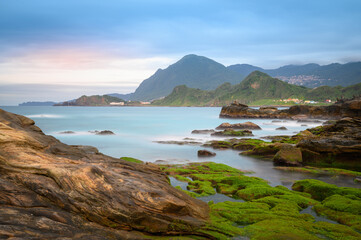 A mountain village facing the sea. A romantic and quiet afternoon view. Looking at the mountain city of Jiufen from Badouzi in Keelung. Taiwan