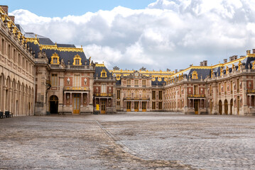Fototapeta na wymiar Facade of the Versailles palace with clouds