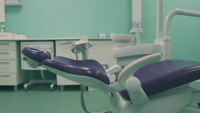 New dental chair in the dental office. Dental clinic interior design with chair and tools medical equipment. DS Dentist's office