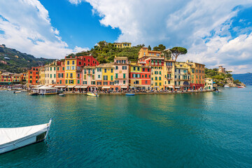 Cityscape and port of Portofino, luxury tourist resort in Genoa Province, Liguria, Italy, Europe. Colorful houses, Mediterranean sea (Ligurian sea).
