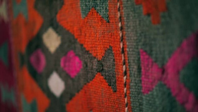 Panorama of handmade carpets with Asian patterns