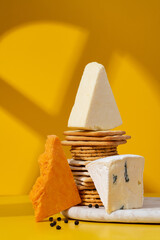 Set or assortment of cheese and crackers. Red stilton, Cambozola, Brie, Cheddar, and Crackers on...