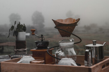 Bamboo drip jug for pouring coffee and kettle.Morning drip coffee set with a cold atmosphere in Thailand, decorated with chocolate tones.