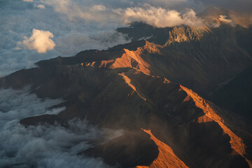 Andes Mountains at sunset. Aerial photo with the amazing sunset landscape over the tallest peaks in South America, part of Andres Mountains.