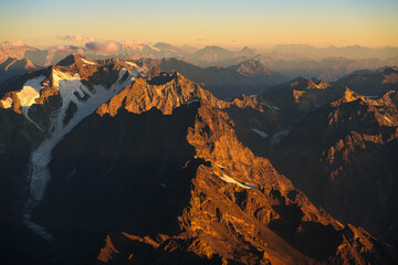 Andes Mountains at sunset. Aerial photo with the amazing sunset landscape over the tallest peaks in South America, part of Andres Mountains.