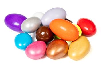 Almond Candies. Nuts and raisins dragee. Chocolate covered dragee candy isolated on white background