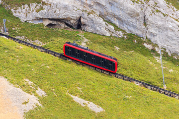 Cogwheel train climbing to the top of Mount Pilatus in Canton Lucerne, Switzerland. World's...