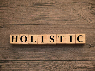 Holistic, text words typography written on wooden lettering, life and business motivational...