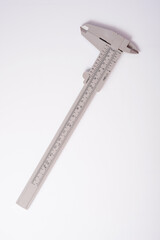 Metal vernier caliper on white background