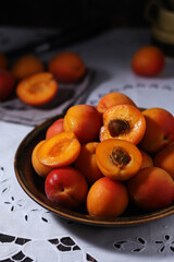 Fresh ripe apricots in bowl in rustic style