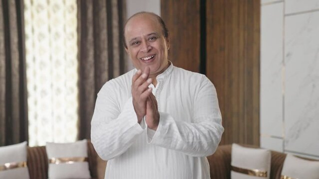 Old Indian uncle clapping and appreciating