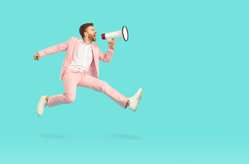 Side profile full body length view man in pink suit jumping up isolated on bright blue copy space...
