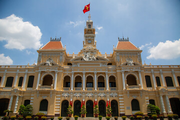 Front view of People's Committee Building of Ho Chi Minh City, the texts on the plate are the name of the building in Vietnamese and English.