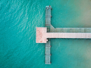Aerial view of Coogee Jetty with blue water. Sunny day in summer with turquoise water. Travel to Coogee, Western Australia, Australia. Top view. Coastal, Seascape