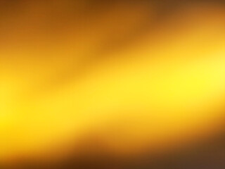 blurred background gradient gold color with abstract light