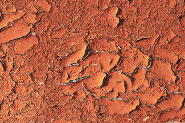 Texture of old cracked oil paint on the wall. Close-up.