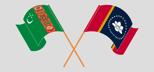Crossed and waving flags of Turkmenistan and The State of Mississippi