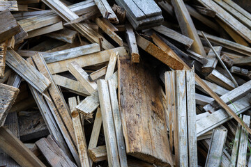 Pile of old timber wood on a backyard