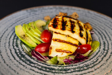 Close-up - Grated haloumi cheese with mixed salad and croutons