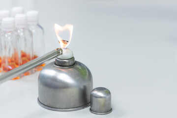 Kindle fire on alcohol burner or alcohol lamp in laboratory.