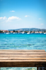 Wooden table blurred Croatian sea in Vodice background. AI generative