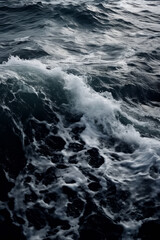 Naklejka na ściany i meble Dark black and white close-up photo of an ocean wave captures the raw power and beauty of nature, contrasting foamy white water with deep black hues. Minimalist monochrome sea landscape. Generative AI