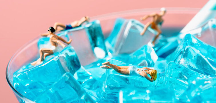 miniature people in swimsuit on a cocktail, banner