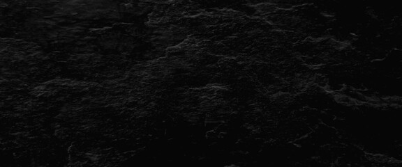 Black or dark gray stone texture background, empty grey marble tabletop with dark black cement stone background for product displayed in rustic mood and tone.