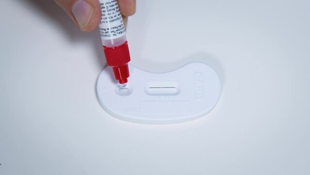 Urine and buffer mix applied to immunological rapid test device for self-testing procedure
