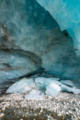 inside an blue ice cave in the swiss alps
