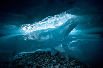 magical blue ice structures in a glacier cave in the Swiss Alps
